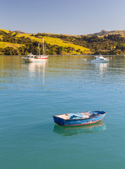 Empty blue rowing boat Akaroa Harbor © steheap