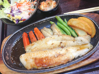 Fish fillet with fresh herbs