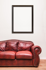 Luxurious Red Leather Couch in front of a blank wall