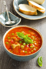 Bowl of minestrone soup with bread