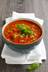 Bowl of minestrone soup with bread