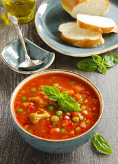 Bowl of minestrone soup with bread