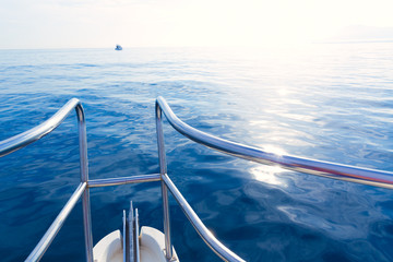 Fototapeta na wymiar Boat bow sailing in blue calm sea at blue Mediterranean