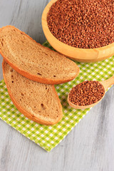 Composition with raw chopped corn in bowl, and fresh bread