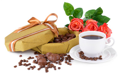 Delicious chocolates in box with flowers isolated on white