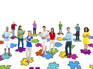 Group Of Multi-Ethnic People Standing On Jigsaw Puzzle