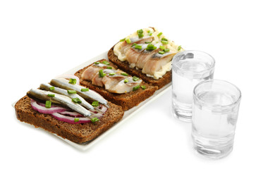 Composition with two glasses  of vodka, and  sandwiches wit