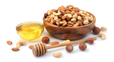 Sweet honey and different nuts, isolated on white