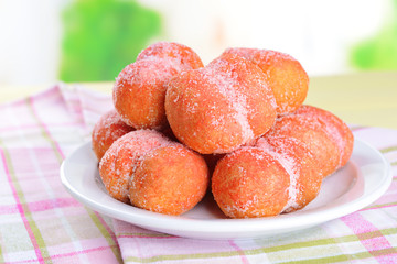 Delicious cookies peaches on table on light background