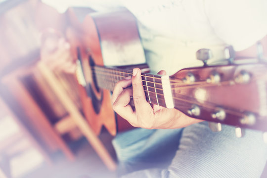 Guitarist plays guitar in vintage style