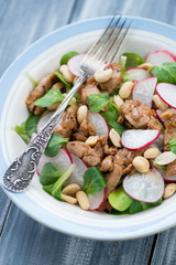 Glass plate with indonesian salad, close-up, vertical shot
