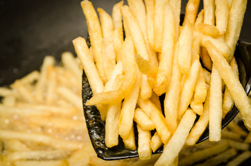 French fries in a hot pan.