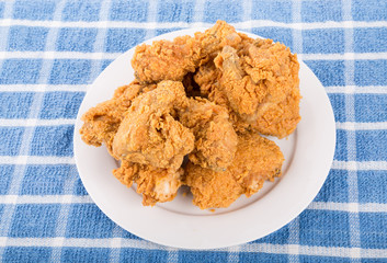 White Plate of Crispy Fried Chicken on Blue Towel
