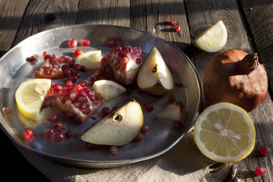 fruits composition with pomegranate lemon and pear