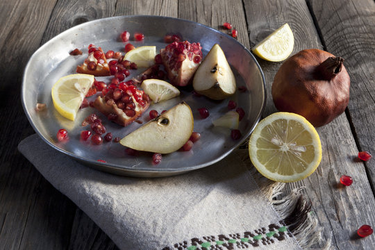 fruits composition with pomegranate lemon and pear