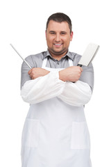 man wearing apron holding knife.