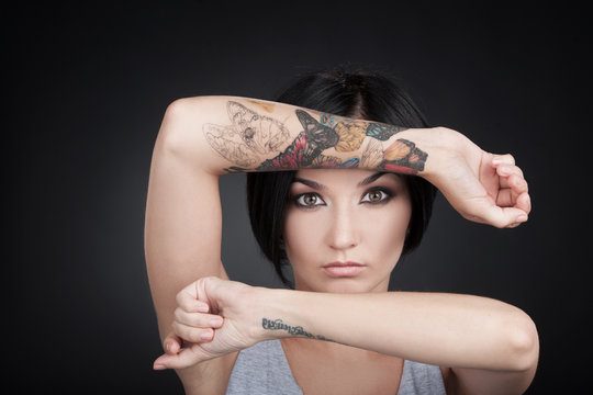 attractive young girl showing tattoo hands.