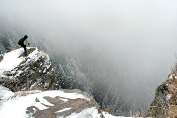 Trekker on the summit at winter
