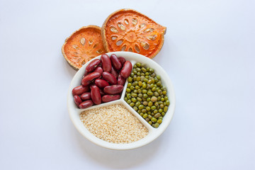 Bael fruit,red beans,chickpea,sesame on a white background