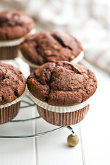 chocolate muffins on white table