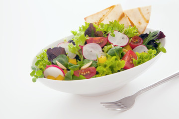 Healthy fresh mixed salad and crisp flatbread