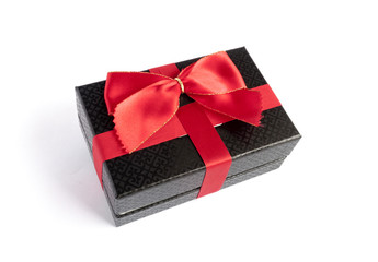 Single black gift box with red ribbon