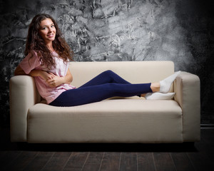 Fototapeta premium Young girl on sofa
