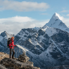 Fototapeta premium Hiker walks on train in Himalayas