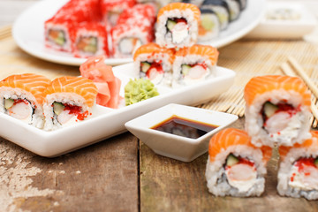 Sushi on a plate and on a table