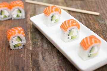 Raw red salmon covered sushi