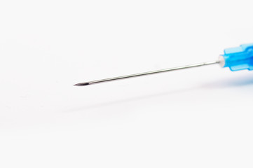 A closeup photo of a syringe needle