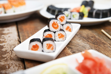 Salmon maki sushi on a white plate