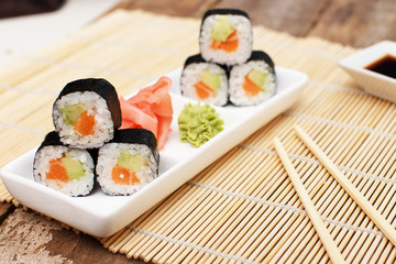 A set of makisushi with ginger and wasabi