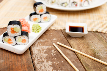 A set of sushi on a rough wooden table