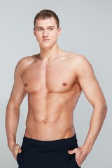 Fototapeta premium Handsome young man with muscular torso