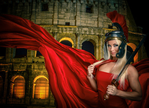 Fit blonde gladiatrix and Colossseum on the background