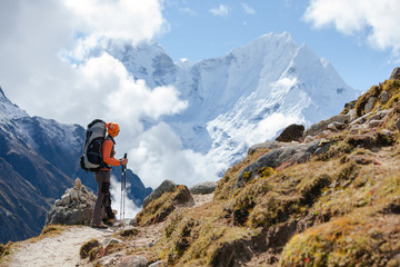 Hiker walks on train in Himalayas