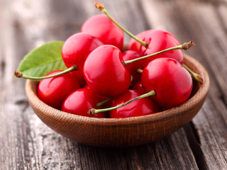 Sweet cherry in a wooden plate