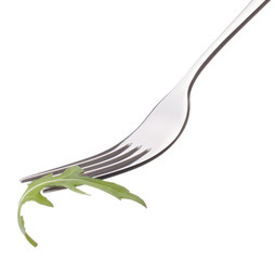 Fresh rucola  salad on fork isolated on white background cutout.