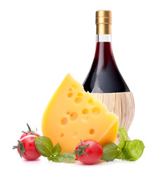 Red wine bottle, cheese and tomato still life