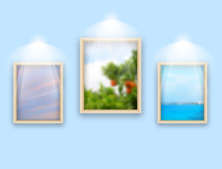 Three frames with photos hanging on wall