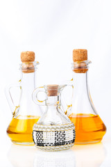 Oil bottles on white