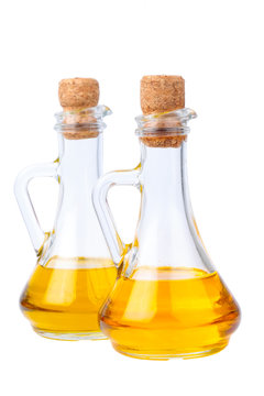 Two oil bottle on white