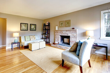 Light tones living room with a rocky background fireplace
