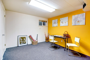 Cozy art room with yellow wall
