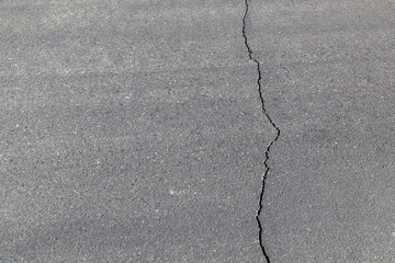 street in detail with cracked asphalt