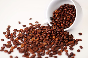 Coffee beans on a cup spilled