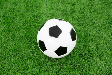 Obraz premium Traditional soccer ball on soccer field