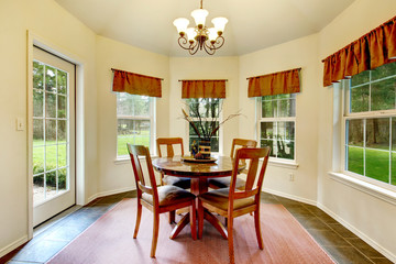 Round corner dining room with french windows