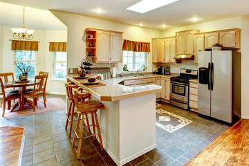 Amazing bright kitchen with maple storage combination. View of d